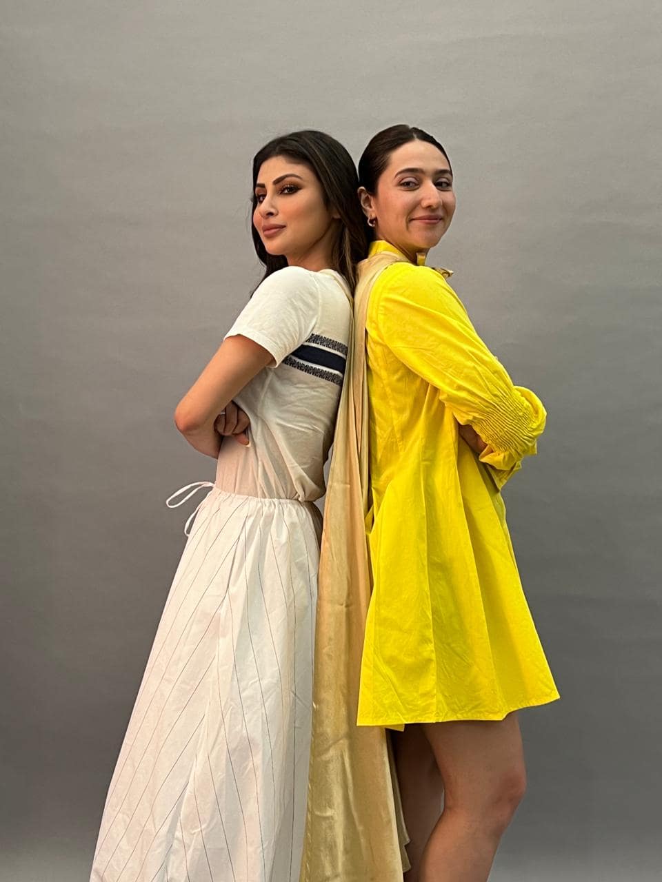 Two models in complementary editorial makeup for a fashion beauty story