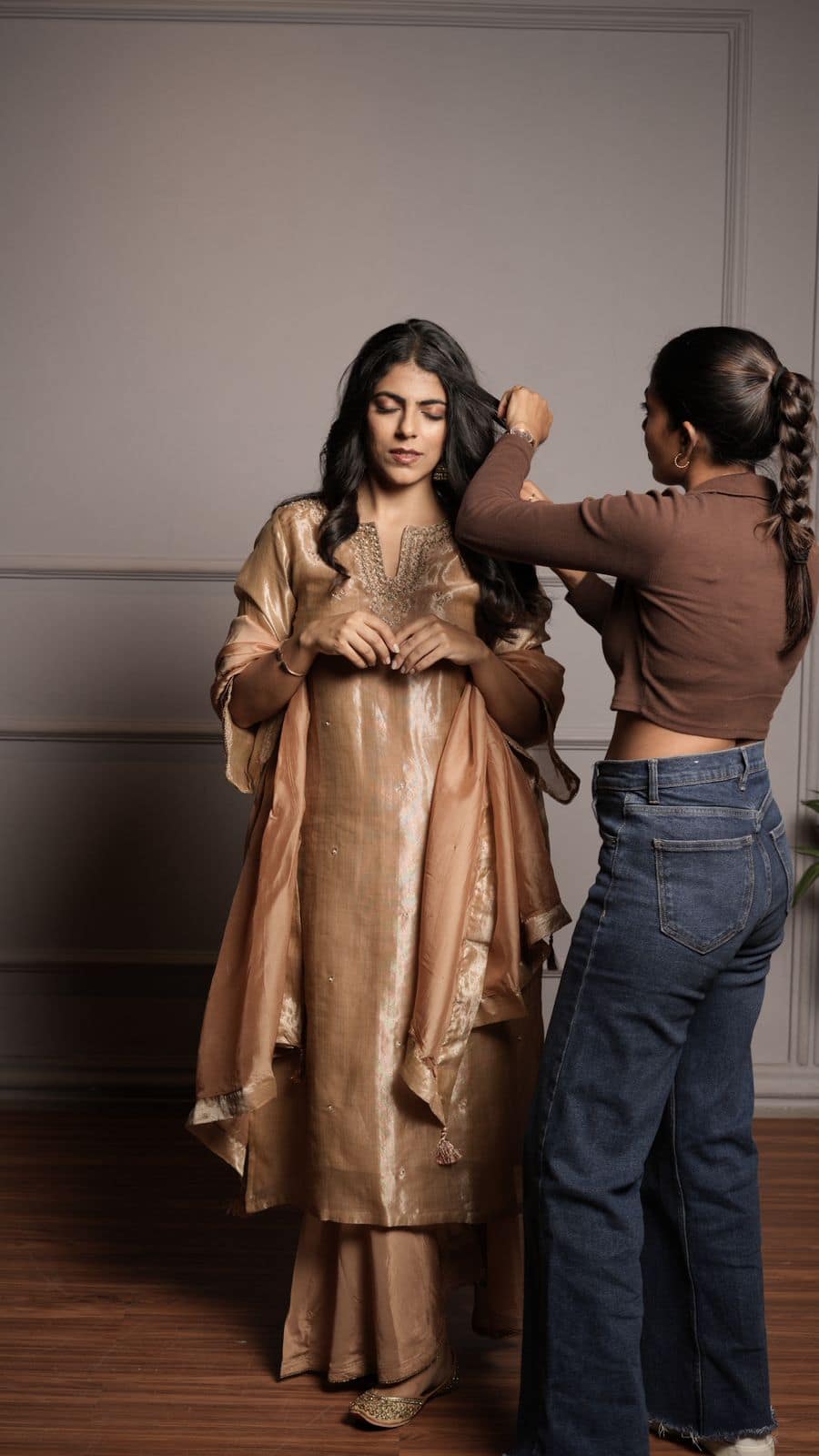 Hair styling for a traditional look, with a smooth centre part and set waves