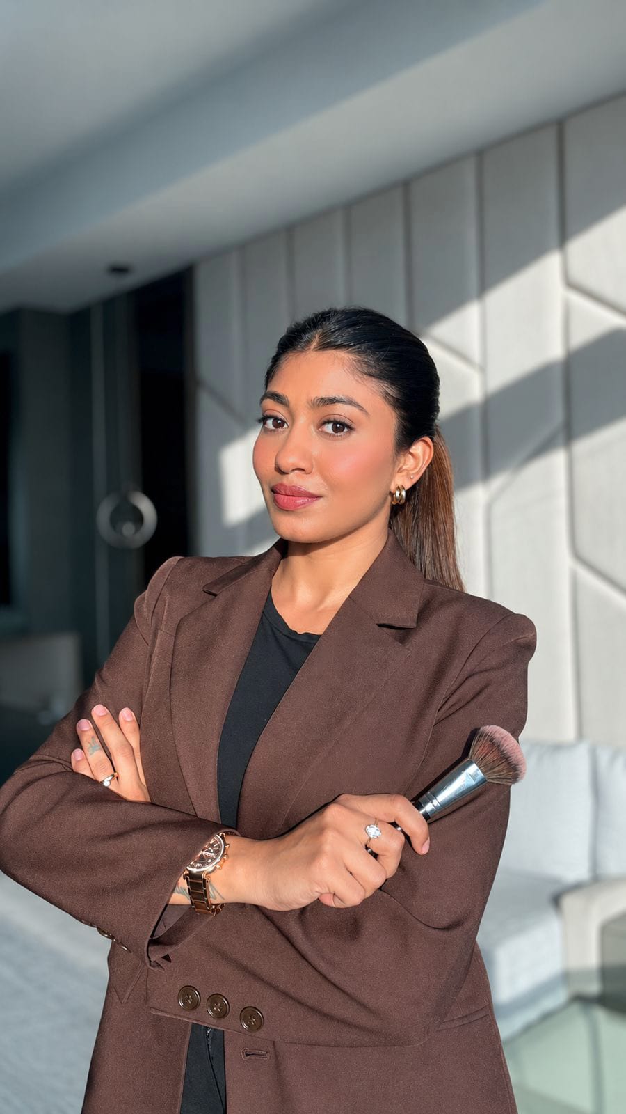 Sheetal Mukhida, celebrity makeup and hair artist based in Dubai, in a studio portrait